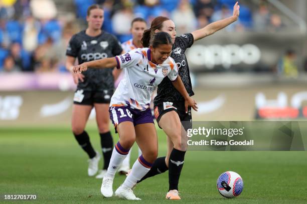 Rasamee Phonsongkham of Perth competes with Mackenzie Barry of Wellington during the A-League Women round six match between Wellington Phoenix and...