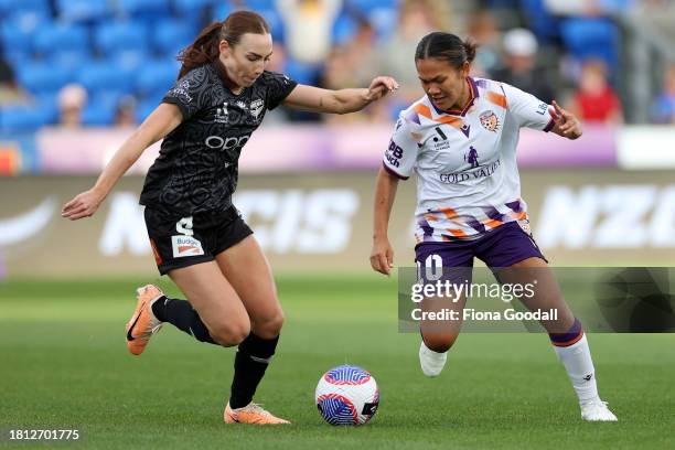 Rasamee Phonsongkham of Perth competes with Mackenzie Barry of Wellington during the A-League Women round six match between Wellington Phoenix and...