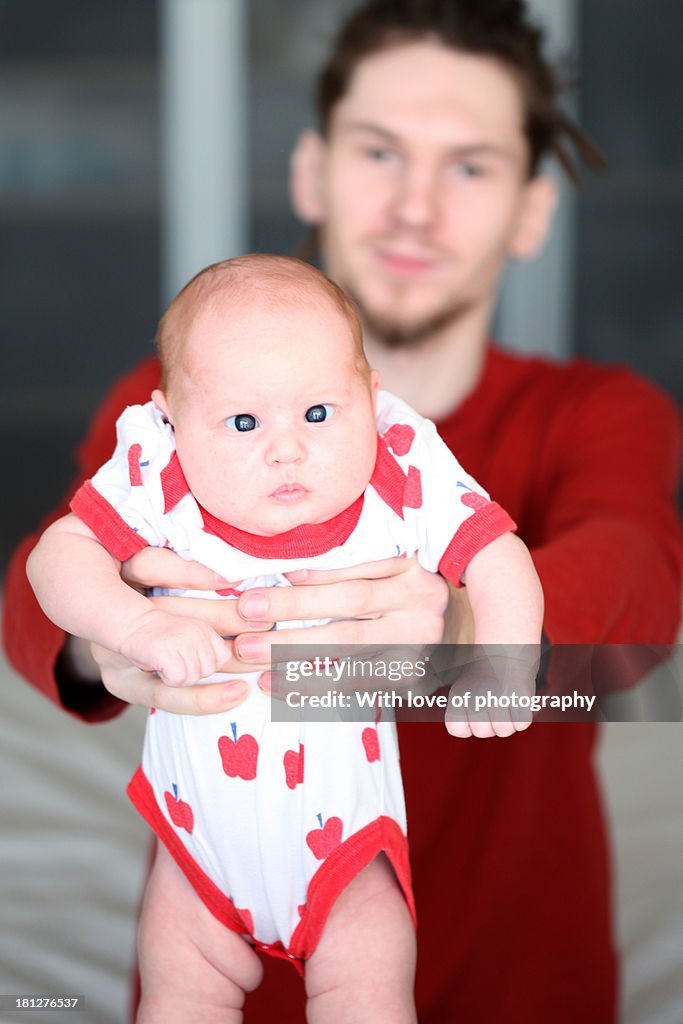 Happy father with newborn daughter