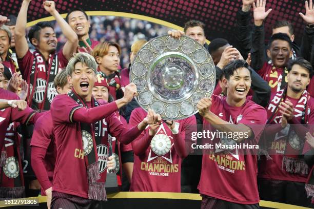 Yuya Osako and Yoshinori Muto of Vissel Kobe lift the trophy after the J.LEAGUE Meiji Yasuda J1 33rd Sec. Match between Vissel Kobe and Nagoya...