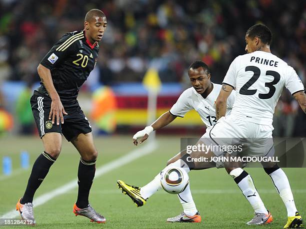 - Picture taken Ghana on June 23, 2010 shows Germany's defender Jerome Boateng fights for the ball with his brother, Ghana's striker Kevin-Prince...