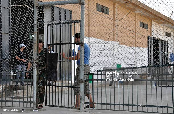Man passing through a door of the prison in Aleppo on August 21, 2013 in Aleppo,Syria. The Aleppo prison in the Al Ray building where about 50...