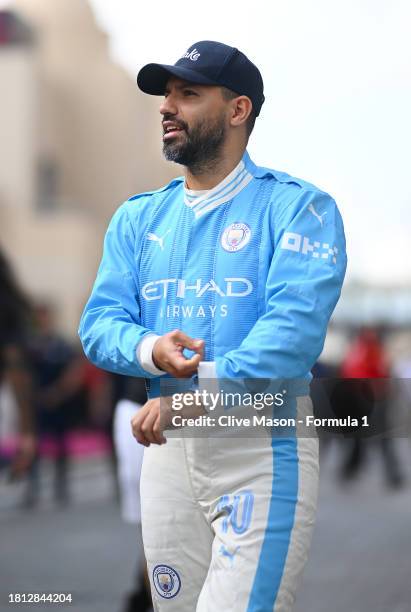 Footballer Sergio Aguero arrives in the paddock ahead of final practice ahead of the F1 Grand Prix of Abu Dhabi at Yas Marina Circuit on November 25,...