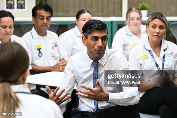 Prime Minister Rishi Sunak speaks with students in the canteen area during a visit to a medical training centre at the University of Surrey on...