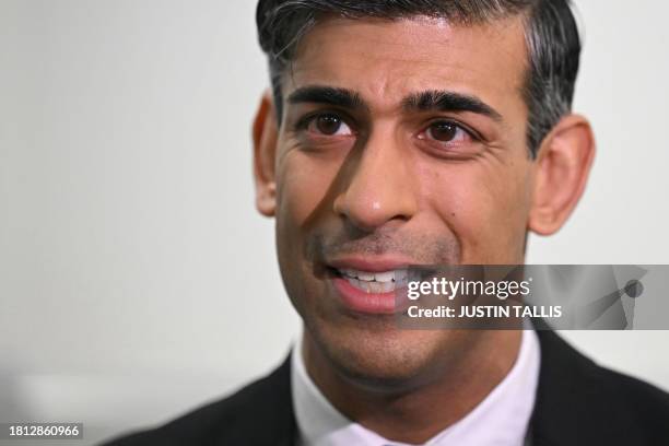 Britain's Prime Minister Rishi Sunak speaks to journalists during a visit of a medical training centre at the University of Surrey in Guildford,...