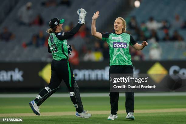 Kim Garth of the Stars celebrates with Sophie Reid of the Stars after dismissing Tammy Beaumont of the Renegades during the WBBL match between...