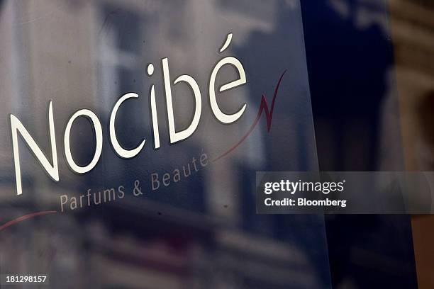 Logo sits on display in the window of a Nocibe SA beauty store in Paris, France, on Thursday, Sept. 19, 2013. Bank of France General Council member...