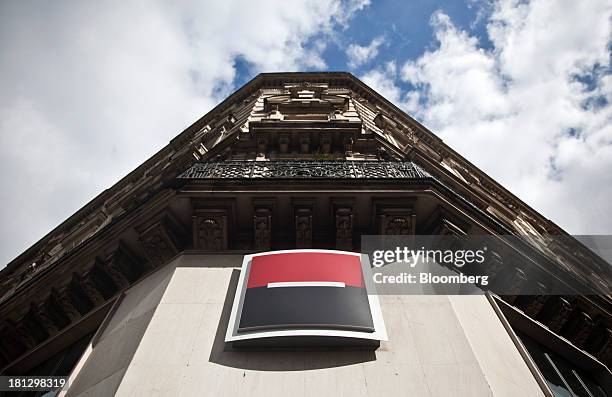 Logo sits on display outside a Societe Generale SA bank branch in Paris, France, on Thursday, Sept. 19, 2013. Bank of France General Council member...