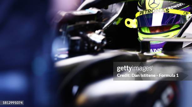 Lewis Hamilton of Great Britain and Mercedes prepares to drive in the garage during final practice ahead of the F1 Grand Prix of Abu Dhabi at Yas...