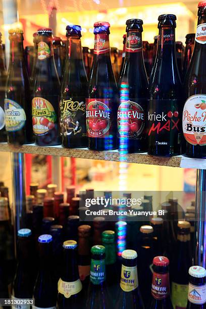 beer bottles display in store window - belgium beer stock pictures, royalty-free photos & images