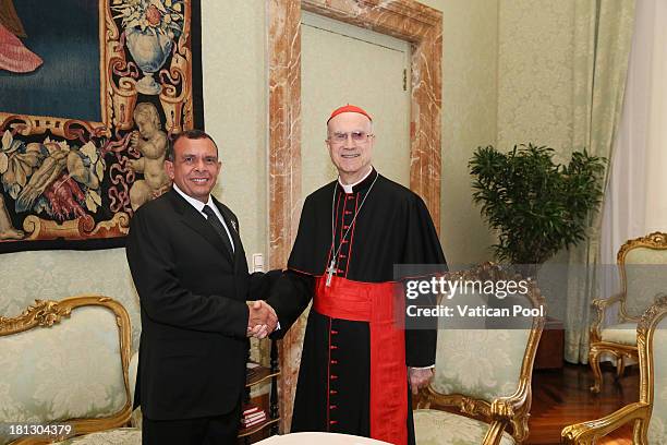 Honduras President Porfirio Lobo Sosa meets with the Vatican Secretary of State cardinal Tarcisio Bertone after an audience with Pope Francis on...