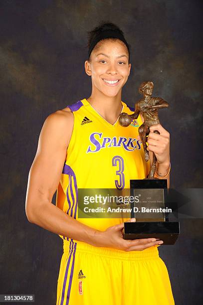 Candace Parker of the Los Angeles Sparks poses with her trophy for being awarded the WNBA's Most Valuable Player for the 2013 season at STAPLES...