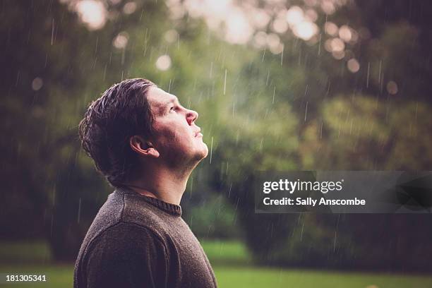 man stood in the rain - all weather stock pictures, royalty-free photos & images