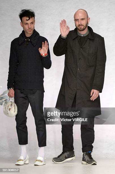 Designers Benjamin Kirchoff and Edward Meadham walk the runway at the Meadham Kirchhoff show during London Fashion Week SS14 at TopShop Show Space on...