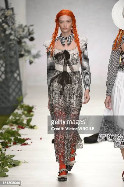 Model walks the runway at the Meadham Kirchhoff show during London Fashion Week SS14 at TopShop Show Space on September 17, 2013 in London, England.