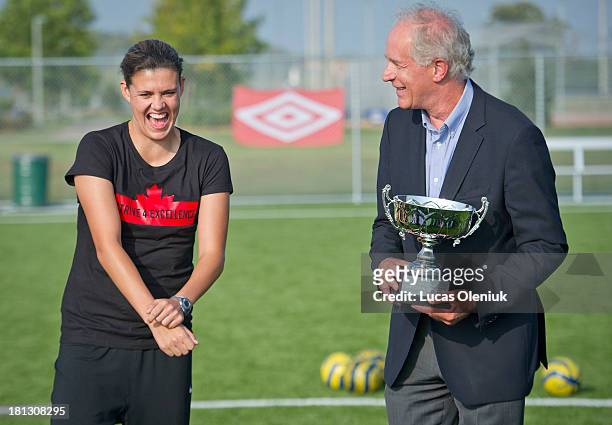 Bob Hepburn of the Toronto Star presented the Lou Marsh Trophy to Canadian Olympic soccer player Christine Sinclair at Concord Park Thursday...