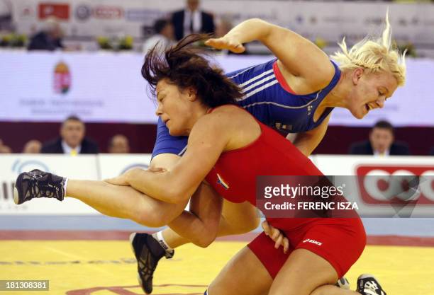 France's Cynthia Vanessa Vescan fights with Estonia's Epp Mae during the qualification round of the women's free style 72 kg category of the World...