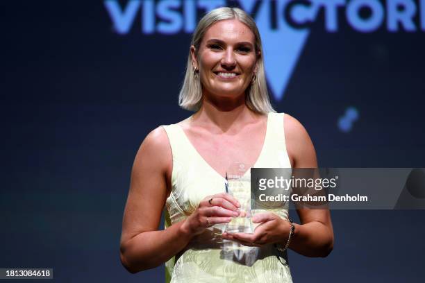 Courtney Bruce poses onstage after receiving the Liz Ellis Diamond award during the 2023 Australian Netball Awards at The Forum on November 25, 2023...