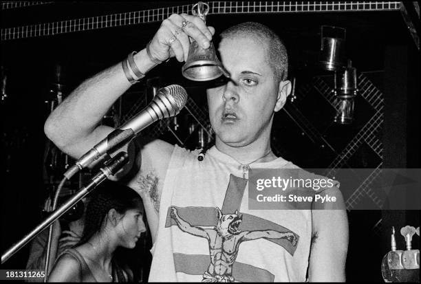 English singer-songwriter and artist Genesis P-Orridge using a hand bell at the first British performance by experimental music group Psychic TV, at...