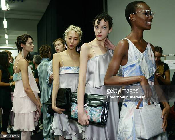 Models poses backstage ahead of the Emporio Armani show as a part of Milan Fashion Week Womenswear Spring/Summer 2014 on September 20, 2013 in Milan,...
