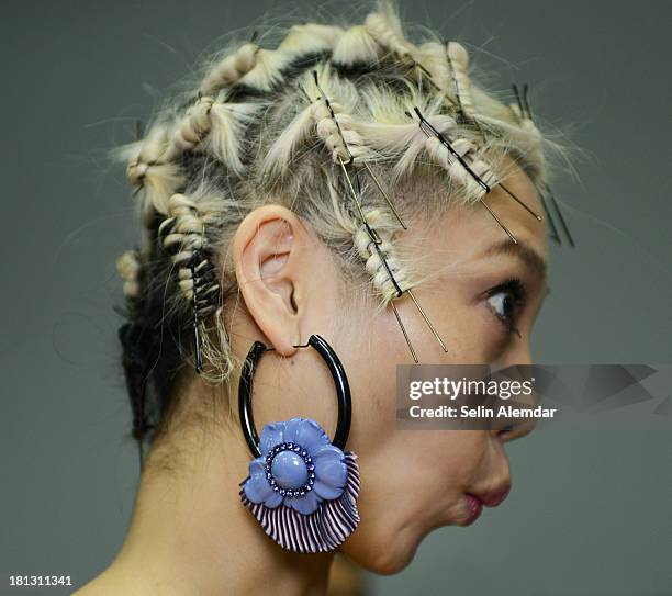 Model poses backstage ahead of the Emporio Armani show as a part of Milan Fashion Week Womenswear Spring/Summer 2014 on September 20, 2013 in Milan,...