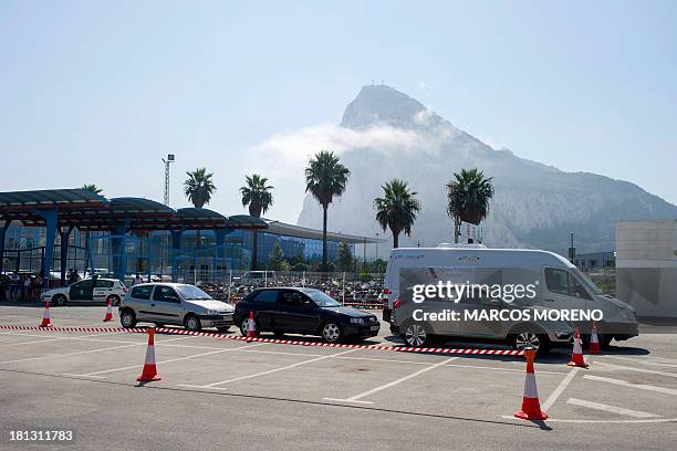 Van of the Spanish customs equipped with a Mobile X-Ray Scanner passes next to cars parked at the border between Spain and Gibraltar in La Linea de...