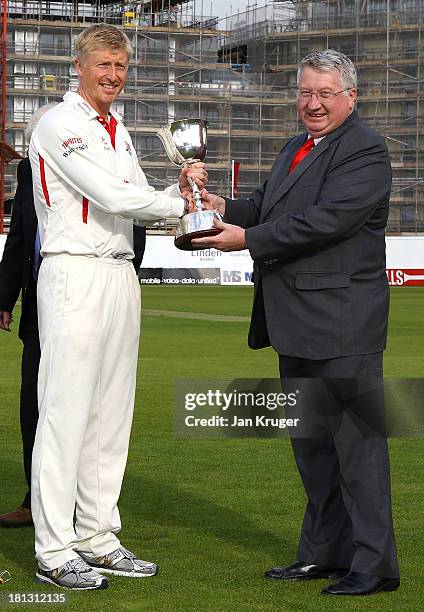 Glen Chapple of Lancashire receives the Division Two trophy from ECB Chief Executive David Collier after the LV County Championship Division Two...