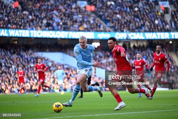 Erling Haaland of Manchester City and Trent Alexander-Arnold of Liverpool battle for possession during the Premier League match between Manchester...