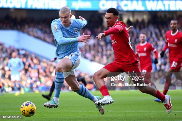 Erling Haaland of Manchester City and Trent Alexander-Arnold of Liverpool battle for possession during the Premier League match between Manchester...