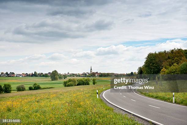 country road in springtime - country road stock pictures, royalty-free photos & images