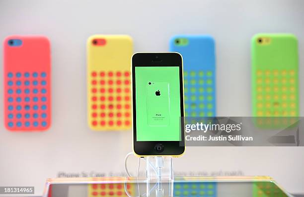 The new Apple iPhone 5C is displayed at an Apple Store on September 20, 2013 in Palo Alto, California. Apple launched two new models of iPhone: the...