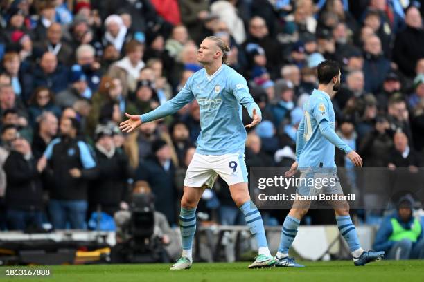 Erling Haaland of Manchester City celebrates after scoring the team's first goal during the Premier League match between Manchester City and...