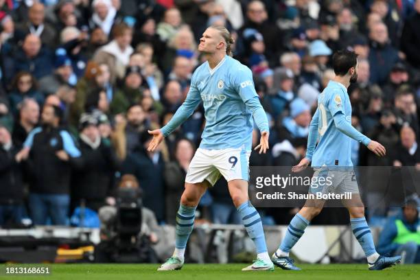 Erling Haaland of Manchester City celebrates after scoring the team's first goal during the Premier League match between Manchester City and...