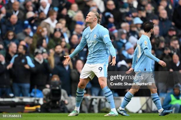 Erling Haaland of Manchester City celebrates after scoring the team's first goal during the Premier League match between Manchester City and...