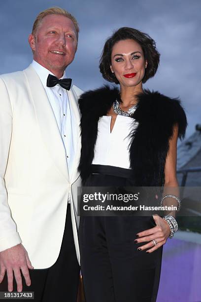 Boris Becker arrives with Sharley "Lilly" Becker for the Laureus Sport for Good Night 2013 at Munich Olympiahalle on September 20, 2013 in Munich,...