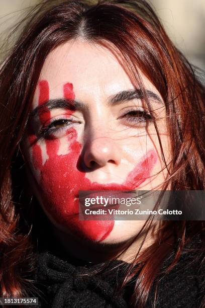 An activist takes part in the demonstration "Il Patriarcato Uccide" , demanding the elimination of violence against women on November 25, 2023 in...