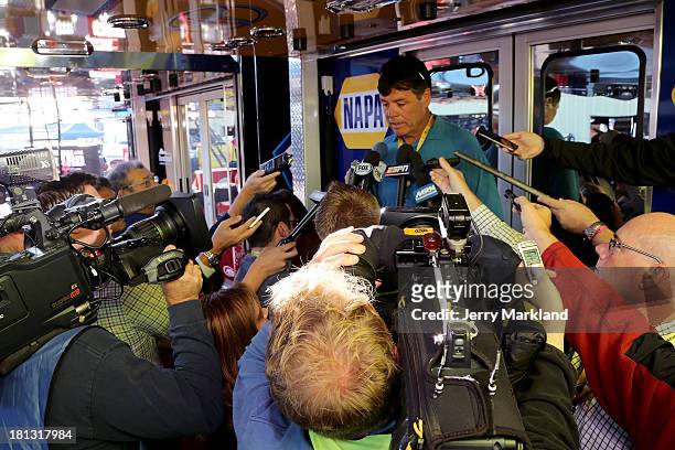 Team owner Michael Waltrip speaks to the media at New Hampshire Motor Speedway on September 20, 2013 in Loudon, New Hampshire.
