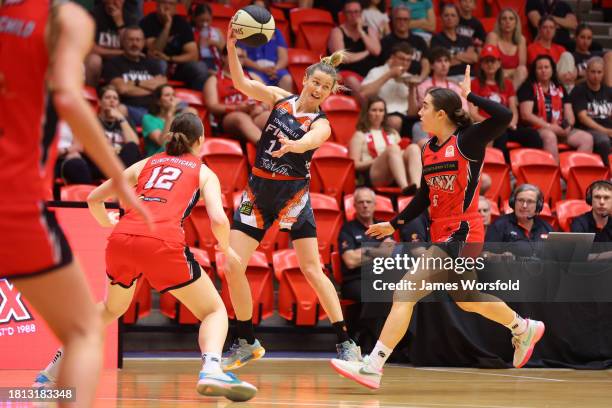 Sami Whitcomb of the Fire passes the ball ba during the WNBL match between Perth Lynx and Townsville Fire at Bendat Basketball Stadium, on November...