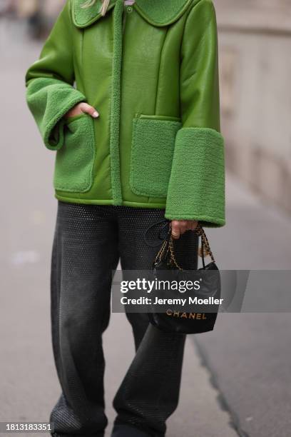 Karin Teigl seen wearing Baum & Pferdgarten green leather jacket with fake fur details / collar and sleeves, H&M grey sparkling / rhinestone pattern...