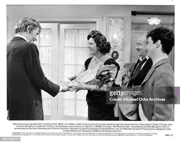Actor Peter O'Toole as Alan Swann with actress Lainie Kazan, actor Lou Jacobi and Mark Linn-Baker on set of the MGM/UA Entertainment movie "My...