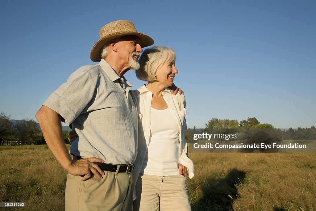 Smiling senior couple in countryside