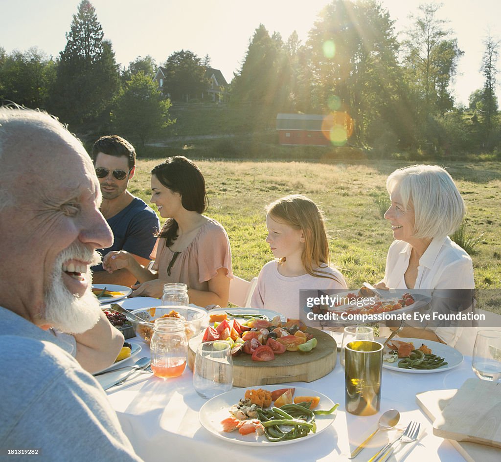 Family having lunch outdoors