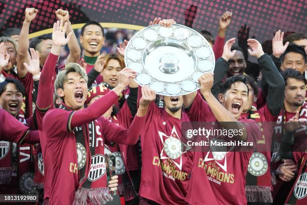 Yuya Osako and Yoshinori Muto of Vissel Kobe lift the trophy after the J.LEAGUE Meiji Yasuda J1 33rd Sec. Match between Vissel Kobe and Nagoya...