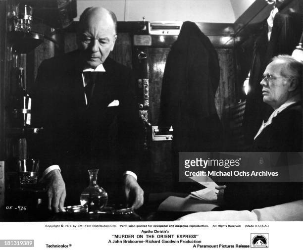 Actor John Gielgud and Richard Widmark on the set of the Paramount Pictures movie "Murder on the Orient Express" in 1974.