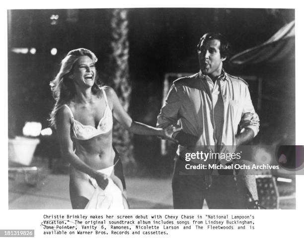 Actress Christie Brinkley and actor Chevy Chase on the set of Warner Bros. Movie "National Lampoon's Vacation" in 1983.