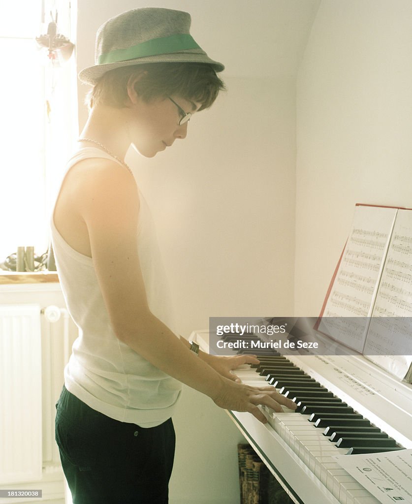 Boy playing piano.