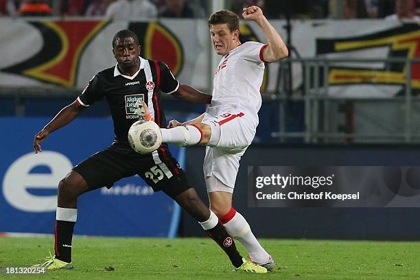 Olivier Occean of Kaiserslautern defends against Kevin Wimmer of Koeln during the Second Bundesliga match between 1. FC Koeln and 1. FC...