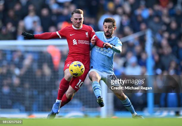 Alexis Mac Allister of Liverpool and Bernardo Silva of Manchester City battle for possession during the Premier League match between Manchester City...