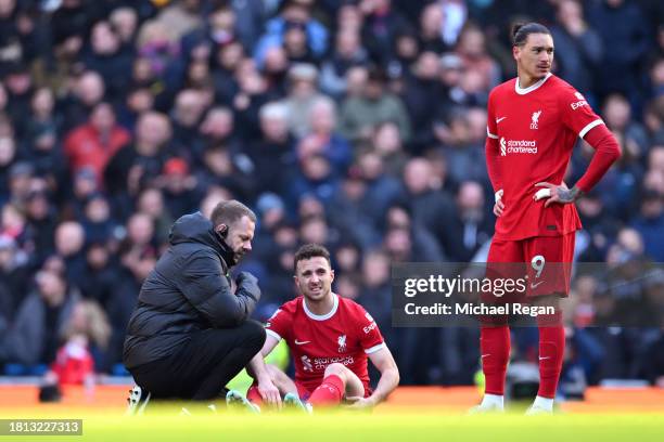 Diogo Jota of Liverpool receives medical treatment during the Premier League match between Manchester City and Liverpool FC at Etihad Stadium on...