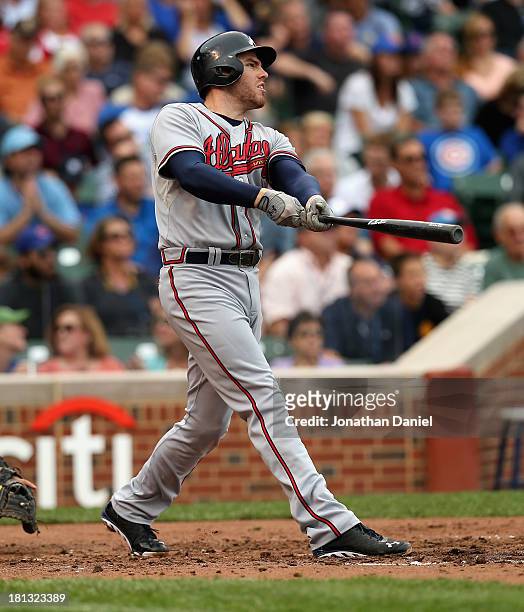 Freddie Freeman of the Atlanta Braves hits a three-run home run in the 3rd`inning against the Chicago Cubs at Wrigley Field on September 20, 2013 in...